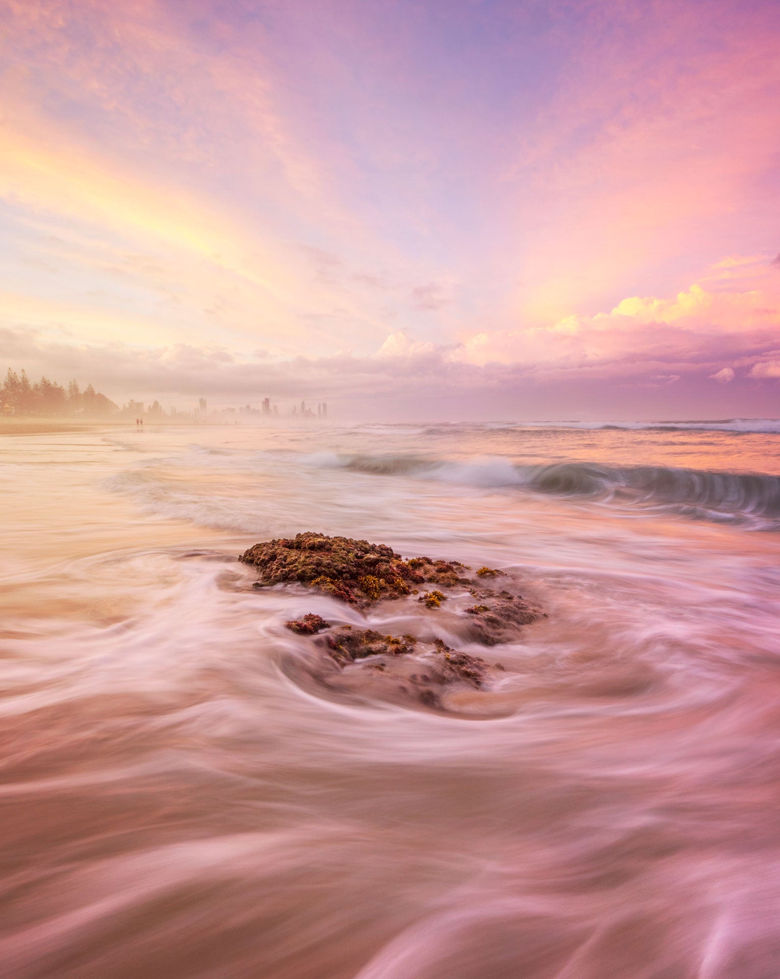 Photographic print of waves rolling over rocks at Miami beach on sunset